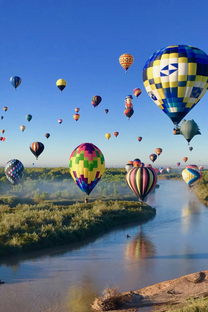 Hot air balloons above the Rio Grande River in Albuquerque.